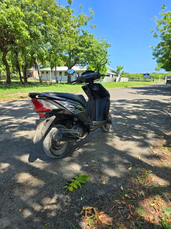 A scooter from the rear three-quarter angle